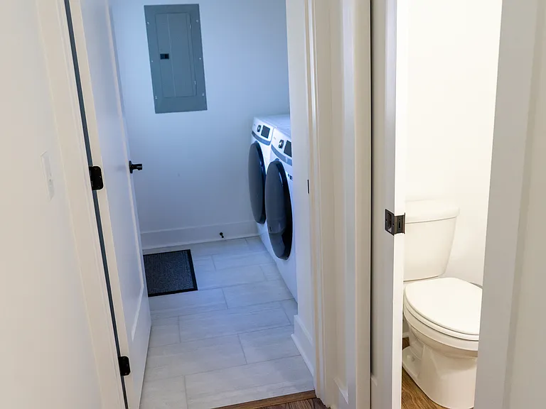Laundry room, half bath and exit to patio/ single, detached garage (1st floor)