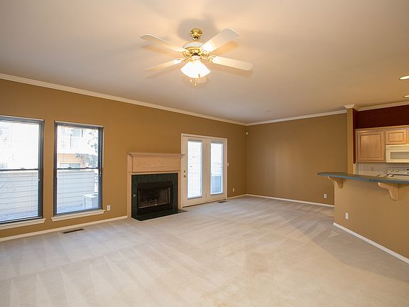 Gracious open design is move-in ready and nicely updated with plush carpet and fresh paint. The open Family Room boasts gas fireplace, ceiling fan, privacy blinds and French door to private courtyard.