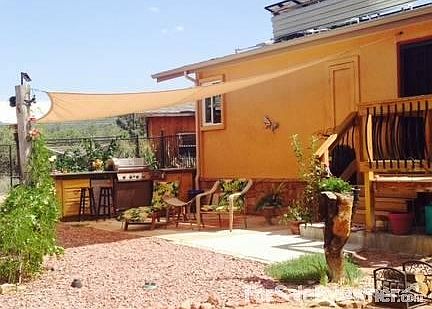 Outdoor kitchen
						:
						Patio and outdoor kitchen with sink, BBQ, and refrigerator