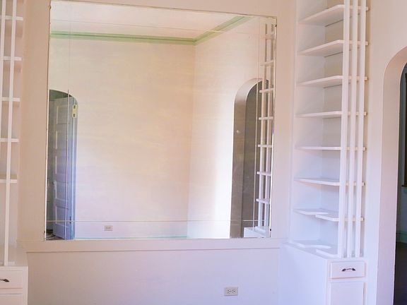 Living Room/ Foyer Area. Plenty of sunlight and vintage buil