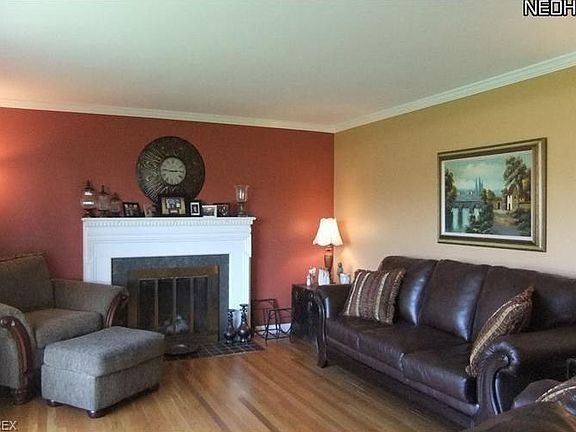 Living Room Features Fireplace With Formal Mantle And Gas Logs. Plus Hardwood Flooring On 1st Floor.