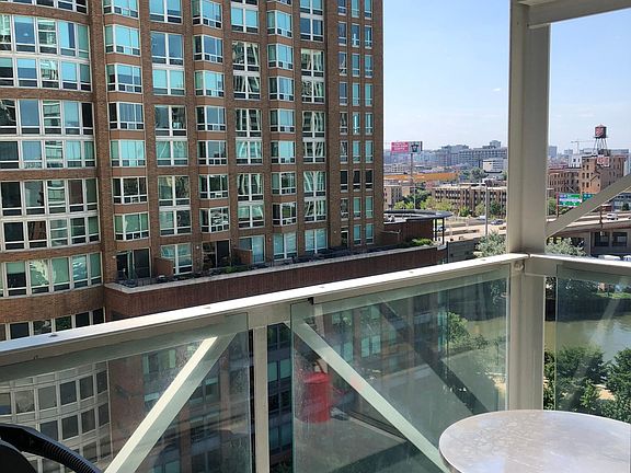 Private balcony, overlooking the Chicago river, Ward Park and the city.