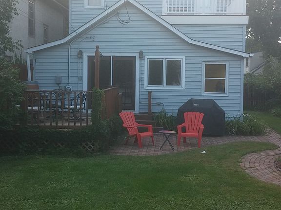 The back yard has 2 decks, nice landscaping and vibrant flow