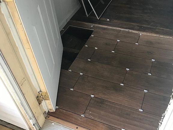 Wood tile to protect your floors from the winter weather!