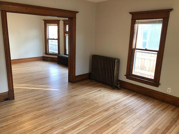 Huge, bright living room plus dining room with bay window. Beautiful original woodwork and plenty of space to make it your own.