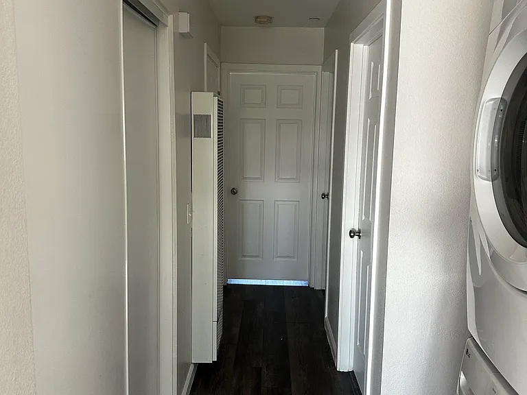 Stackable LG washer and dryer in hallway