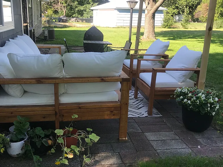back patio overlooking large fence in yard
