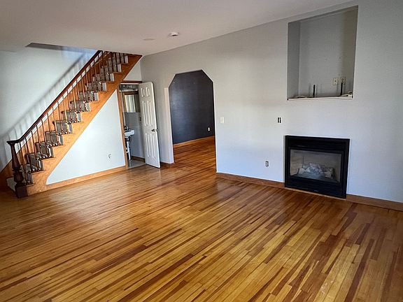 Large living room with tons of natural light and brand new recessed LED lighting. Gas Fire Place.