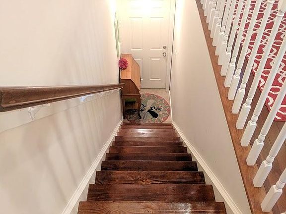 Front door opens to stairs into living space