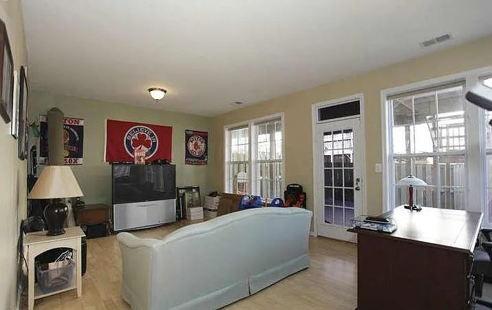 Basement room with wall to wall windows
