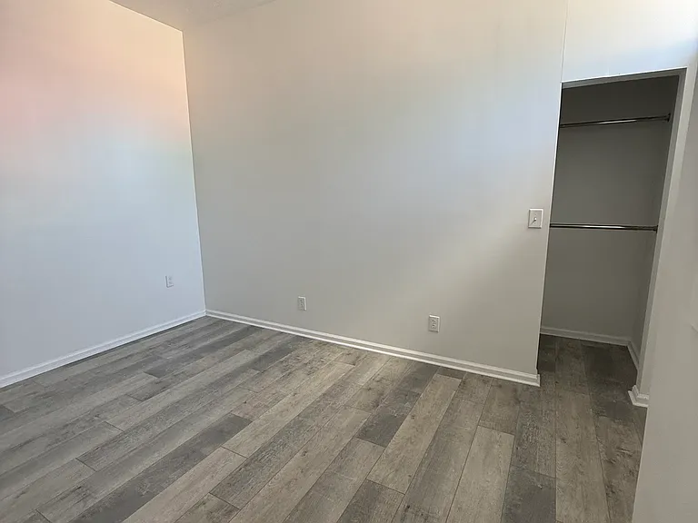 Bedroom with small closet.