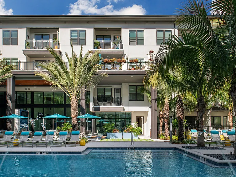 Pool deck with lounge chairs and umbrellas