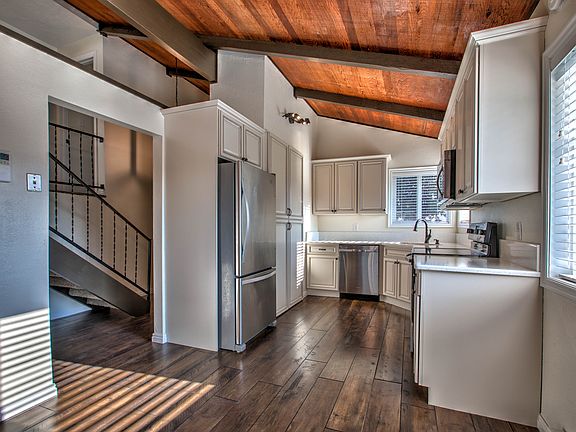 Kitchen with quartz countertops and stainless steel appliances