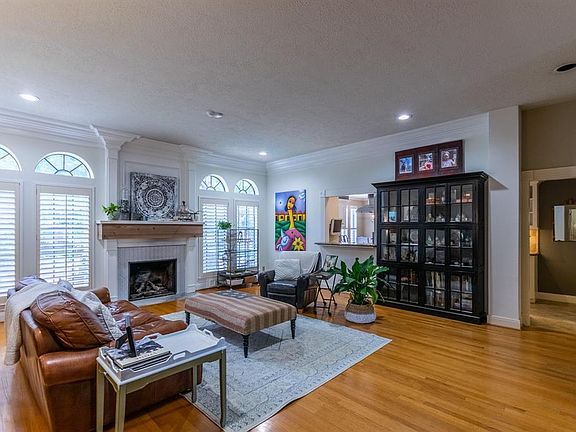 This decedent entertaining space invites you in as you enter the home. The pass thru opening to the kitchen keeps the champagne flowing with ease. With crown molding and architectural details you would expect to find in this estate home.