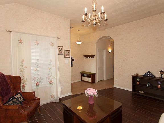 The hallway shown in the photo leads to the guest bedrooms, guest bathroom, laundry room and master suite...