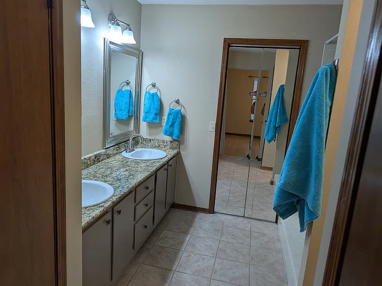 Dual Sinks in Master Bathroom. Large Walk In closet behind mirrored doors.