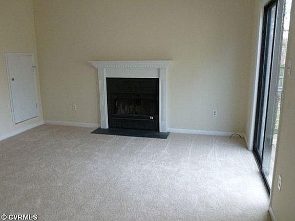 Family room - new carpet and wood burning fireplace