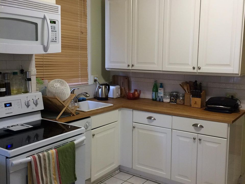 Spacious kitchen with plenty of storage. Countertops and tile floor have been recently replaced (not the ones shown in this photo. Want to see the new kitchen? Ask for pictures). Note the dishwasher to the left of the sink