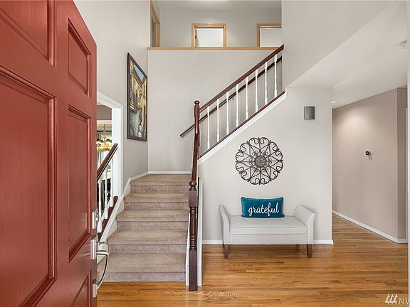 Open foyer with refinished hardwood floors that continue throughout most of the main level.