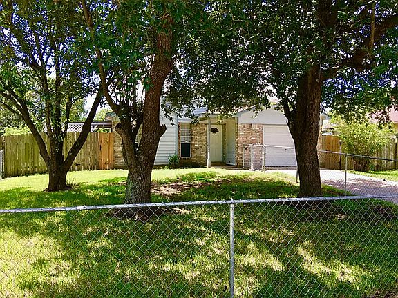 This great home offers fully fenced yard front and back and mature trees