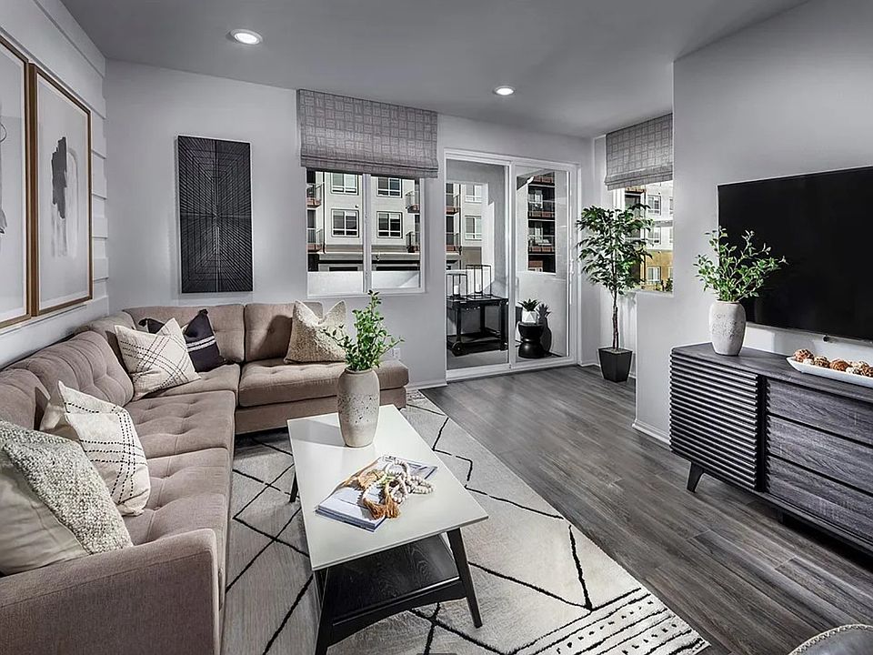 Open-concept living room with modern finishes and natural light