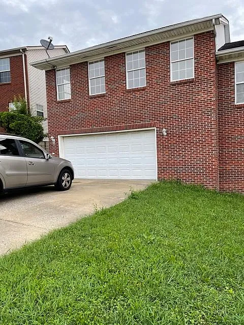 Front of home, entry is on left side of home.