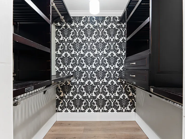 Master Walk-In Closet with Custom Wood Shelving and Drawers