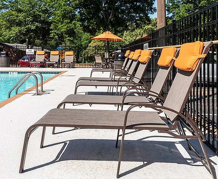 Experience ultimate relaxation at our stunning poolside retreat, complete with comfortable loungers.