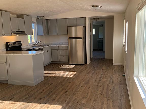 view of living area into open concept kitchen