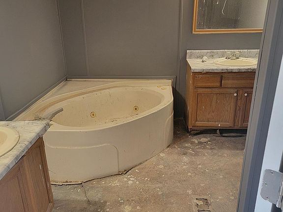 Master Bathroom with Separate Shower- Flooring is being installed