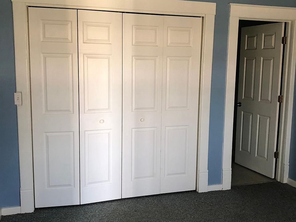 First bedroom closet doors and door to bathroom