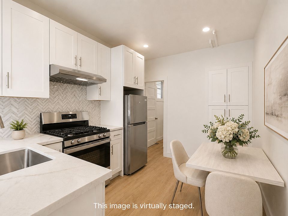 Newly updated bright and light full kitchen area with room for a small table. Pantry in the cabinets on the back wall