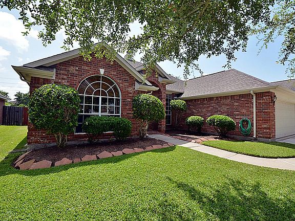 The front garden is accented in stone and perfect for the gardener.