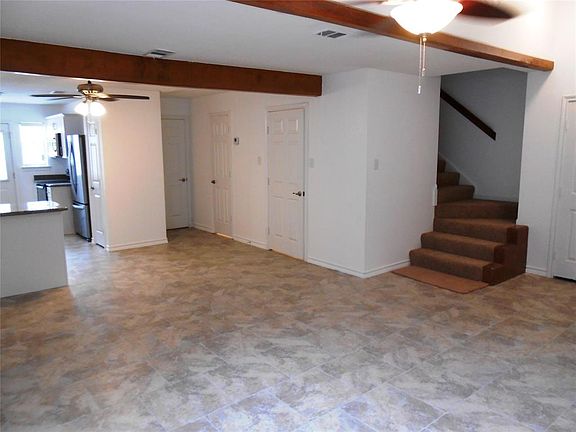Master Suite down with W/D connections in the storage area under the stairs. 2 Bedrooms and the 2nd Bath are at the top of the stairs.