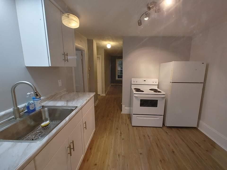 Entry to unit. Kitchen and hallway to Living Room