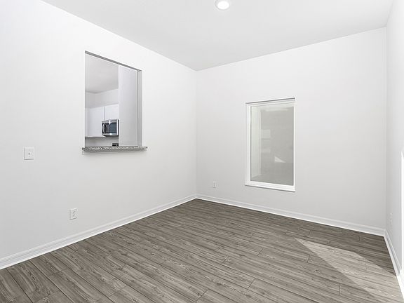 A beautiful dining room with access to the kitchen