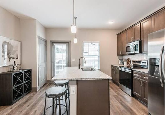 Eat-in kitchen with pantry, opening to private patio.