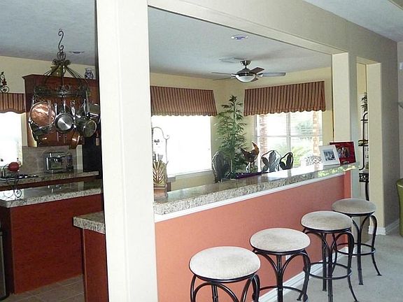 Extra eating are with bar stools, Refrigerator stays with home.