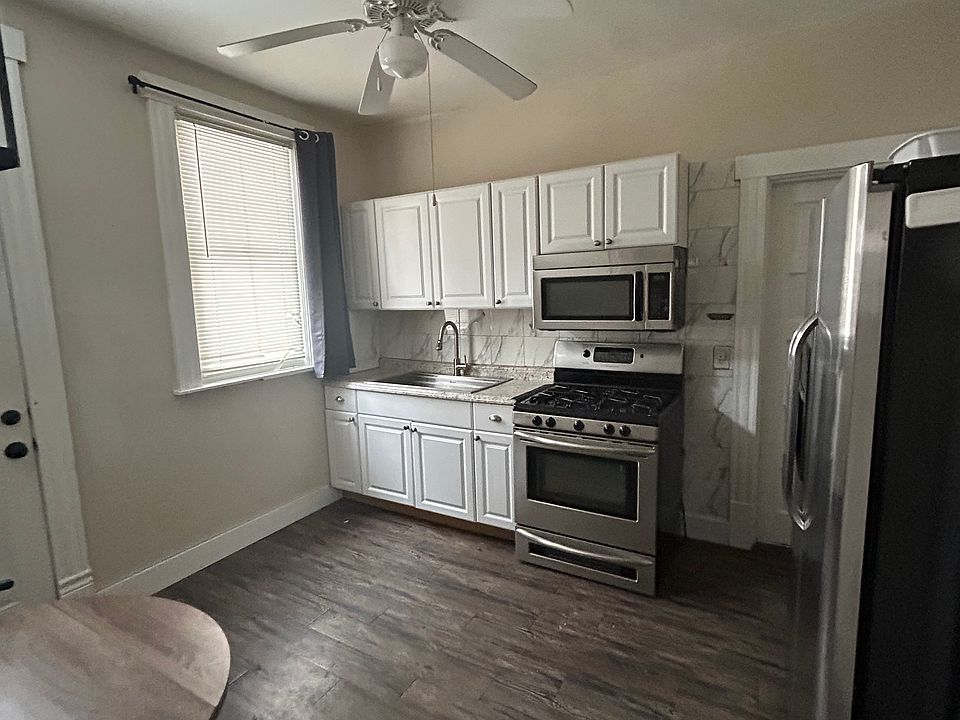 new kitchen appliances - fridge, stove and microwave
