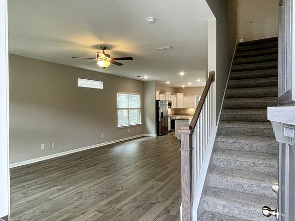 When you enter the home, you are greeted with an open concept great room, breakfast space, and kitc