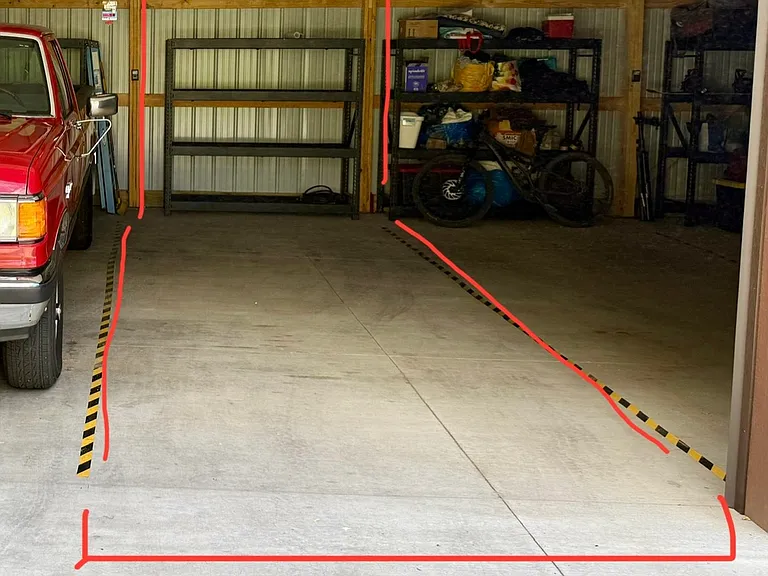 One parking spot in enclosed detached garage with storage space (shelf).