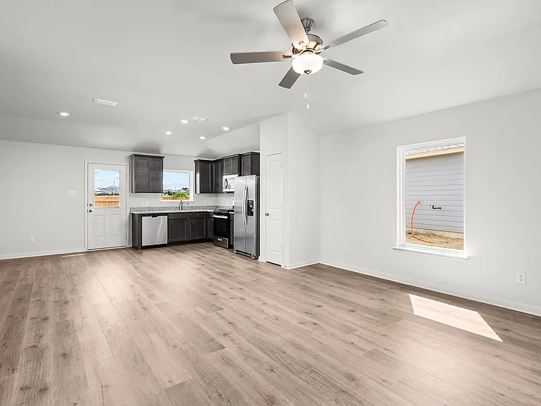 The open concept layout connects the kitchen, dining area and family room.