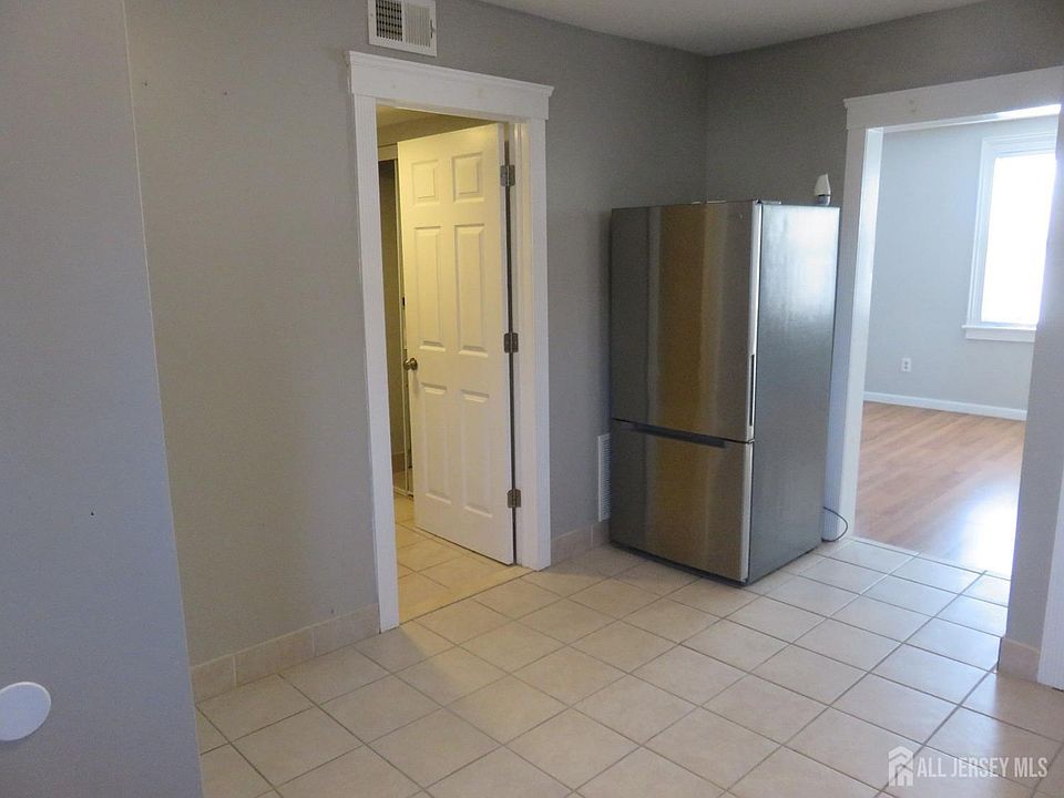 Shared kitchen & dining area, view into living room