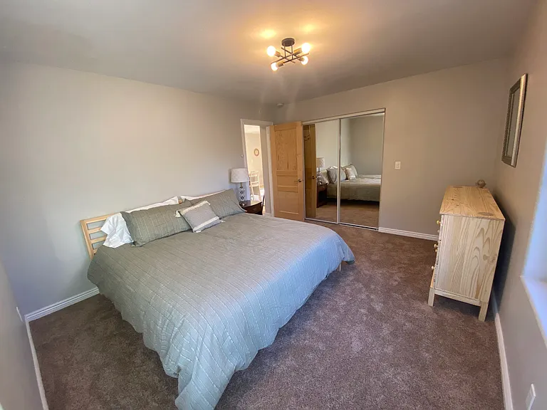 Closet behind sliding mirrored doors. Two nightstands not shown here.