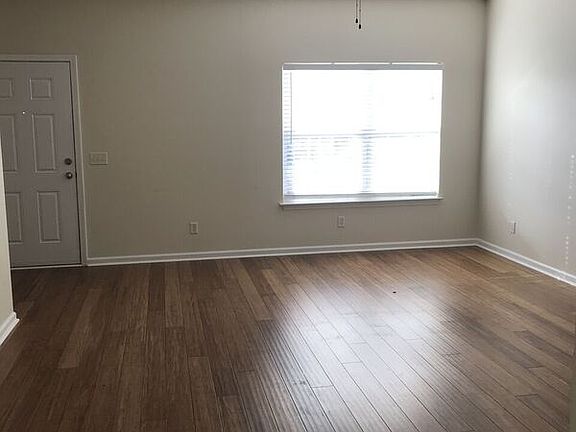 Another angle of the living room and front door.