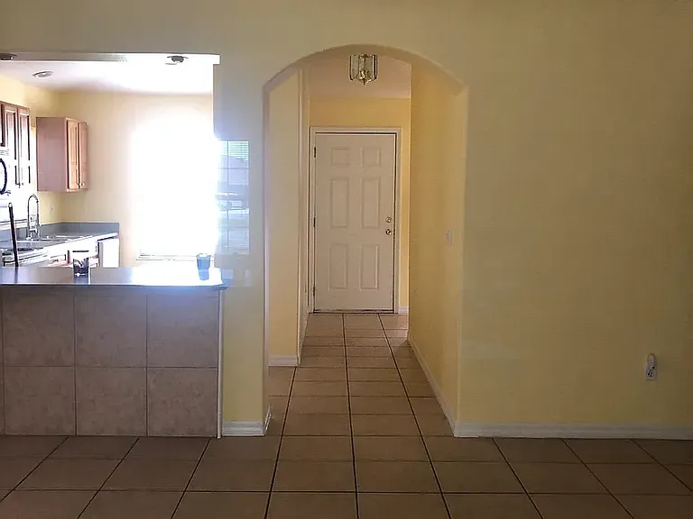 View from Great Room to kitchen and front door