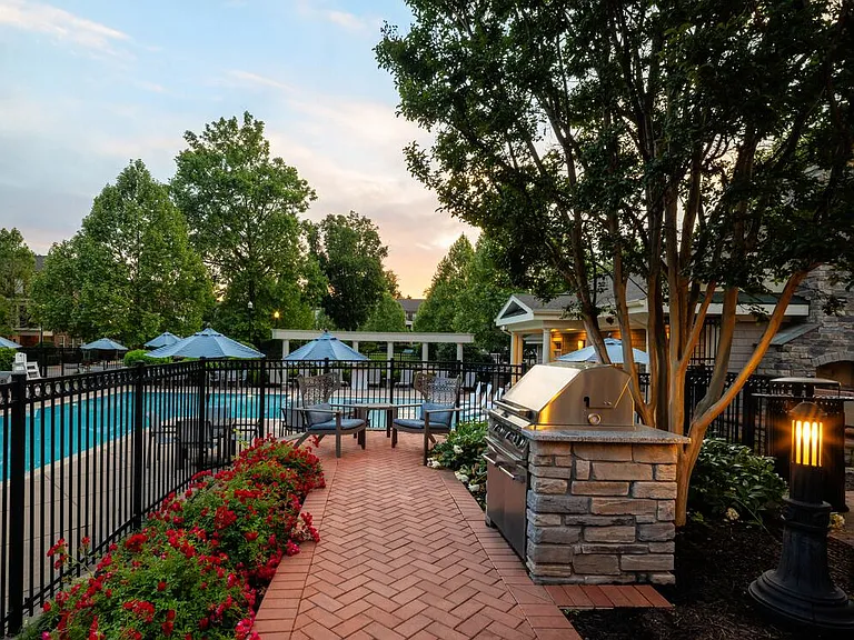 Pool and courtyard with barbeque grills