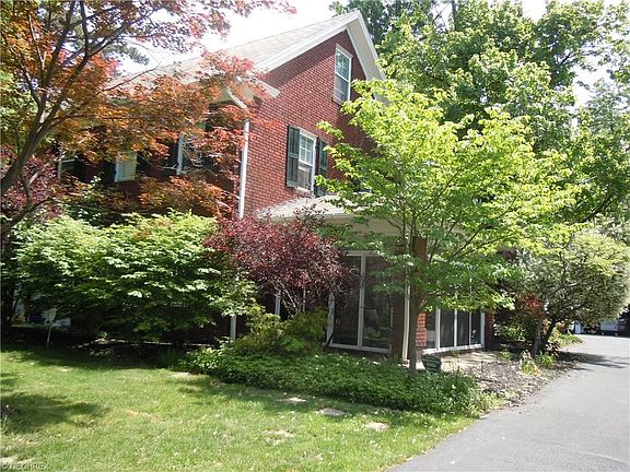 The home is sited back from the road & facing West. You will find sandstone walkway, beautiful mature landscaping shading the home & plenty of grassy area to play, there is even a tree swing in the front  yard!  The back yard offers a large shaded patio &