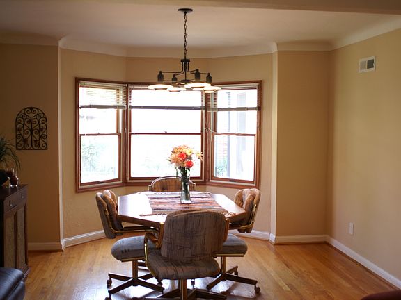 Dining area with Bay Window overlooking Fenced Back yard