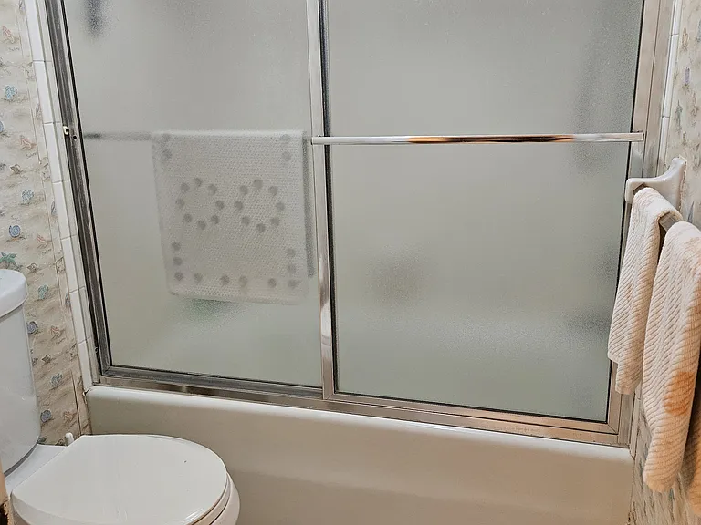 Guest bathroom with tub and shower